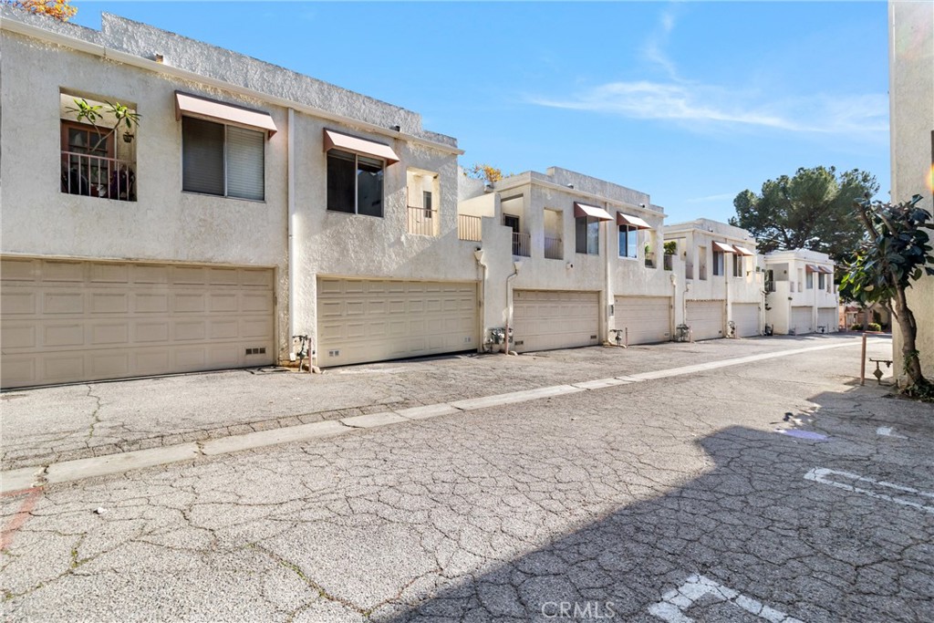 12411 Osborne Street, Unit 2 Pacoima, CA 91331 - Photo 31 of 37 a view of a house with a road