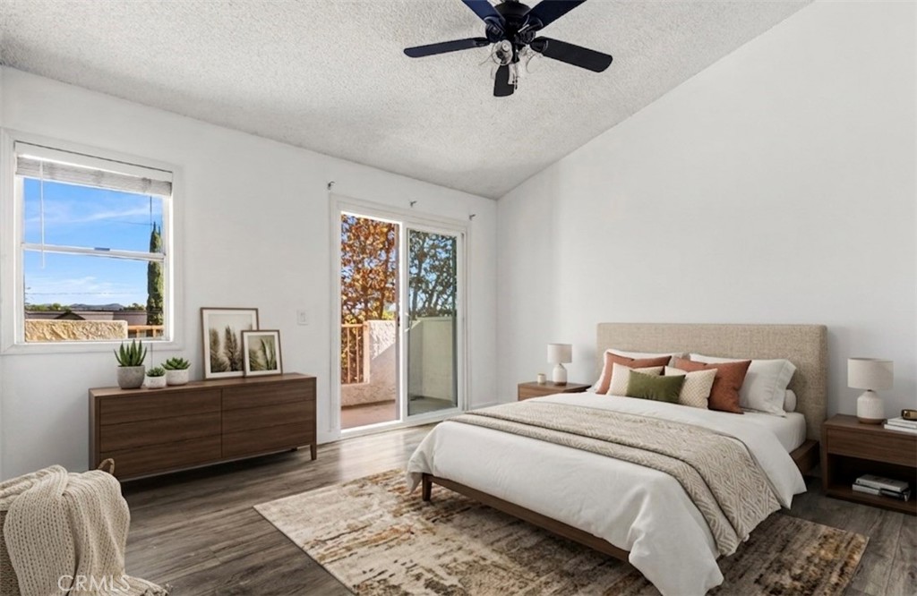 12411 Osborne Street, Unit 2 Pacoima, CA 91331 - Photo 8 of 37 a bedroom with a bed and wooden floor