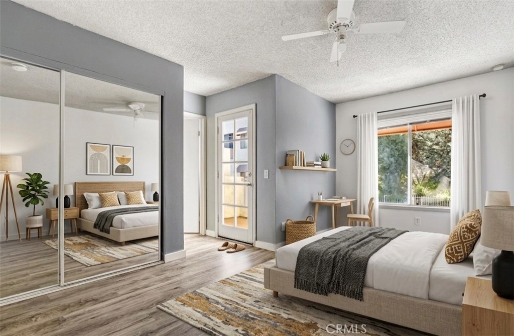 12411 Osborne Street, Unit 2 Pacoima, CA 91331 - Photo 10 of 37 a bedroom with a bed and wooden floor