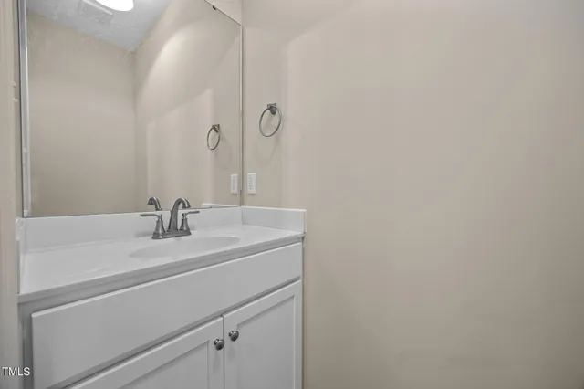 a view of house with a yard