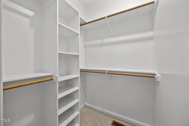 a view of an empty walk in closet
