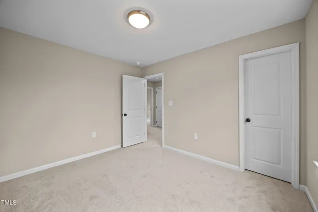 a view of an empty room with windows