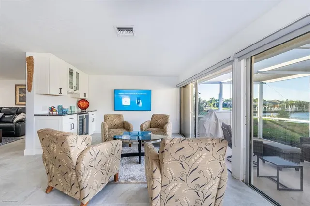 a bedroom with a large bed and a flat screen tv