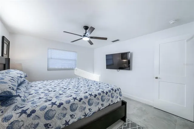 a bathroom with a glass shower door and a shower