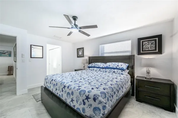 a bed room with a bed and a window