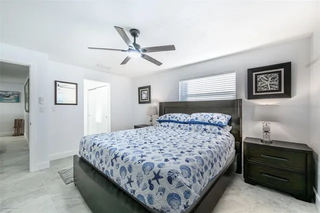 a bed room with a bed and a window