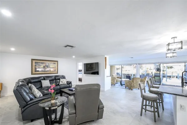 a living room with furniture and a rug