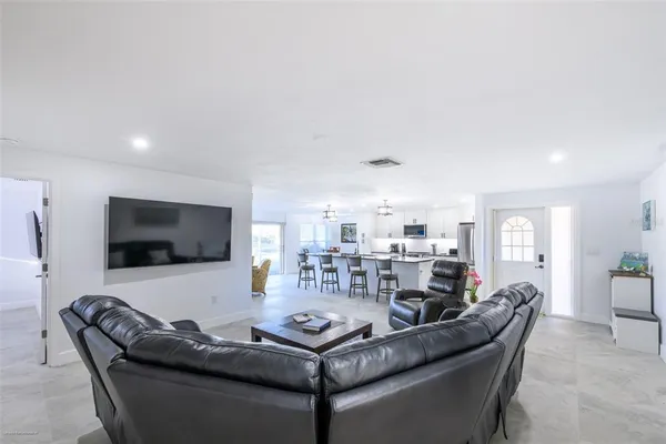 a view of a kitchen and dining room