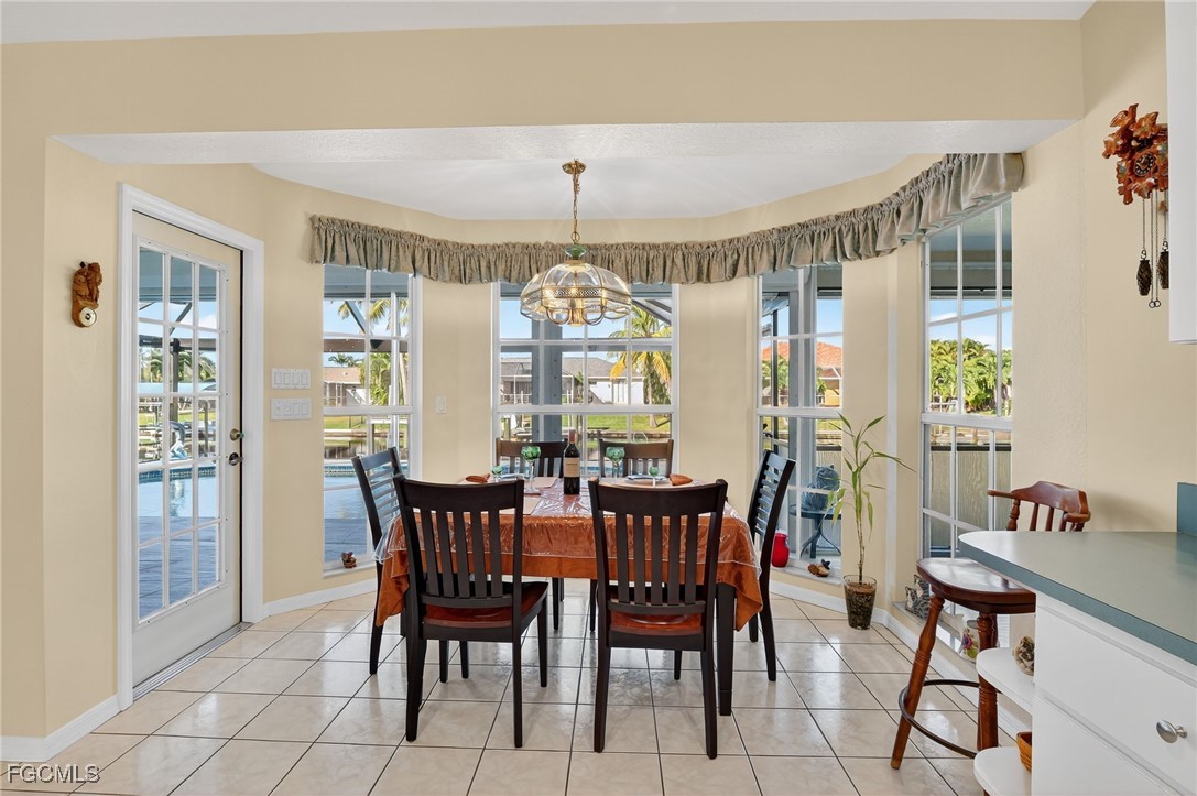 4306 Southwest 3rd Avenue Cape Coral, FL 33914 - Photo 15 of 50 a view of a dining room with furniture window and outside view