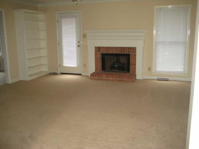 502 Rutherford Lane Columbia, TN 38401 - Photo 4 of 14 Large den with gas log fireplace and built in bookshelves