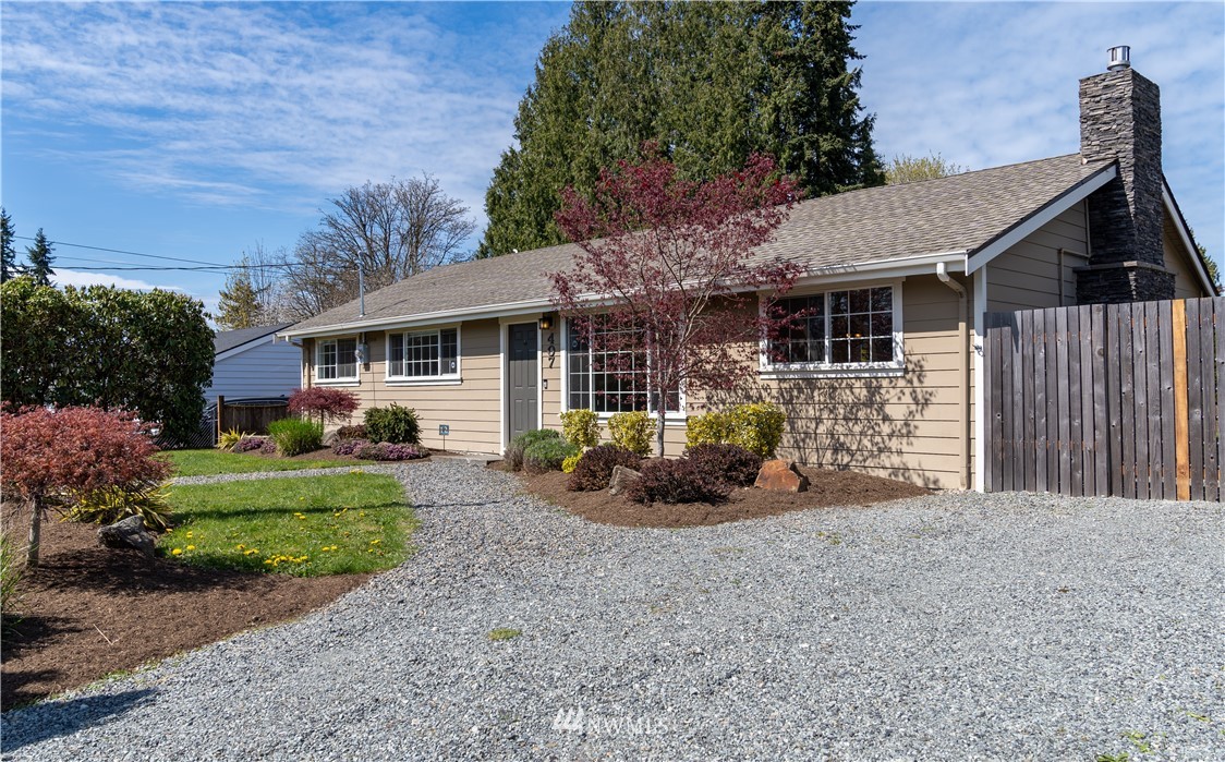 407 216th Street Southwest Bothell, WA 98021 - Photo 1 of 18 a view of a house with backyard and garden