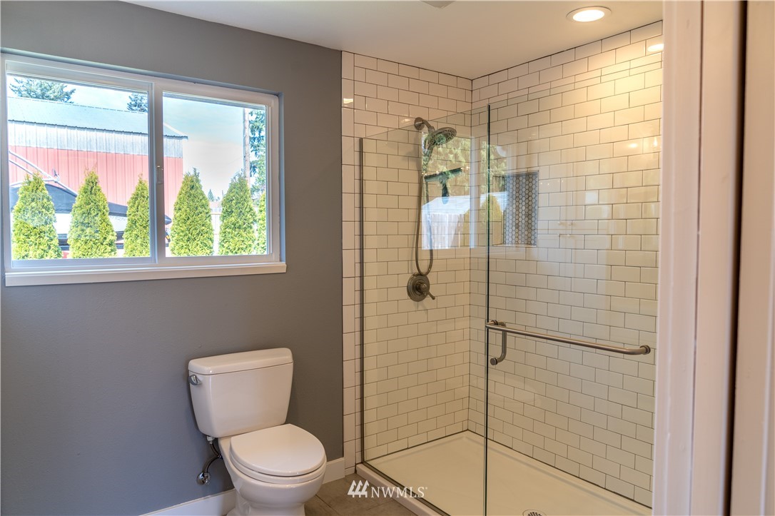 407 216th Street Southwest Bothell, WA 98021 - Photo 11 of 18 a bathroom with a toilet and a shower