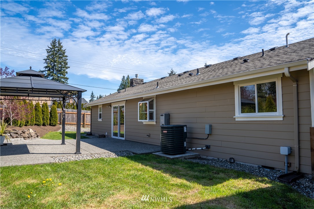 407 216th Street Southwest Bothell, WA 98021 - Photo 18 of 18 a view of a house with backyard and sitting area