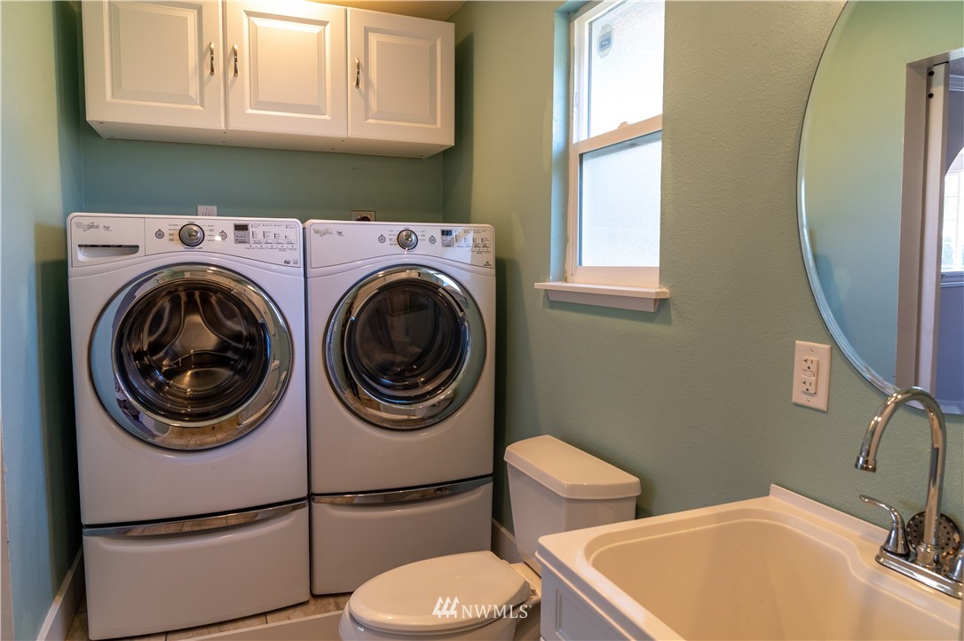 407 216th Street Southwest Bothell, WA 98021 - Photo 7 of 18 a bathroom with a sink a toilet and a window