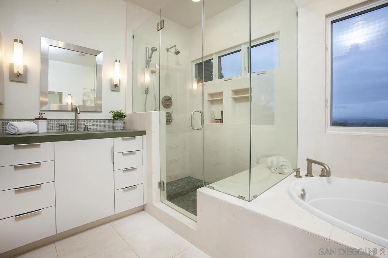 13497 Calais Drive Del Mar, CA 92014 - Photo 17 of 22 a bathroom with a tub sink shower and mirror