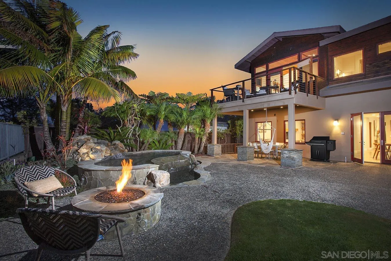 13497 Calais Drive Del Mar, CA 92014 - Photo 2 of 22 a view of a patio with table and chairs potted plants and palm tree