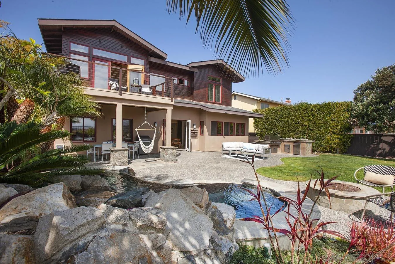 13497 Calais Drive Del Mar, CA 92014 - Photo 6 of 22 a front view of a house with garden and sitting area