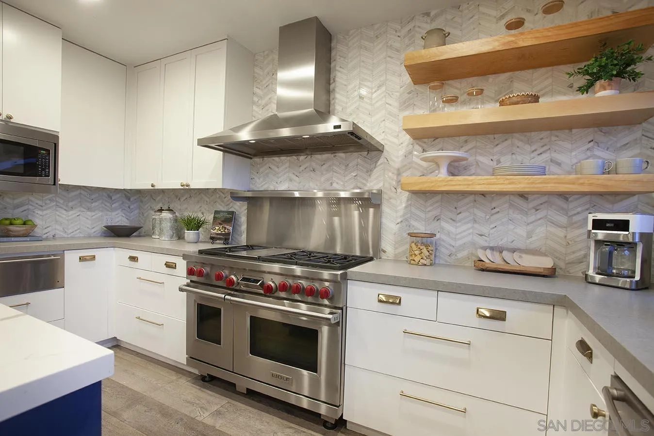 13497 Calais Drive Del Mar, CA 92014 - Photo 10 of 22 a kitchen with cabinets and stainless steel appliances