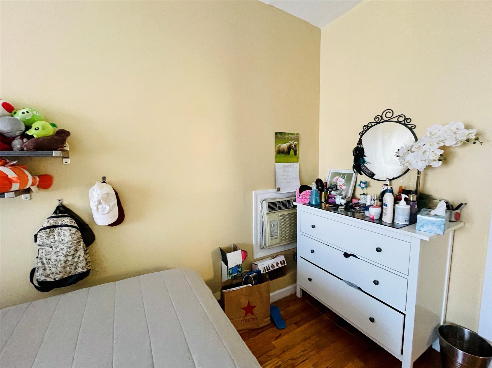 83-10 Pettit Avenue Queens, NY 11373 - Photo 5 of 7 Bedroom featuring dark wood-style flooring