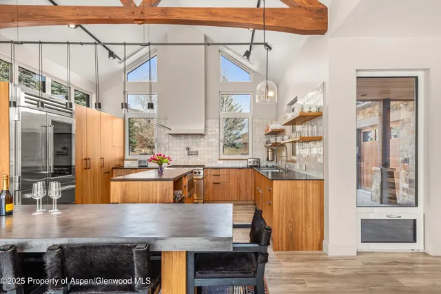 a bedroom with a bed and a fireplace