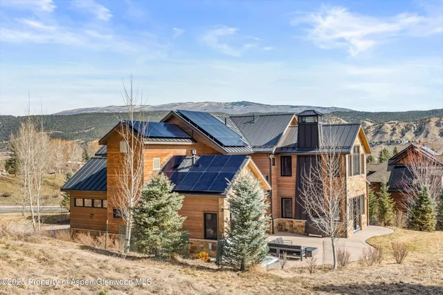 a view of a table and chairs in the garden