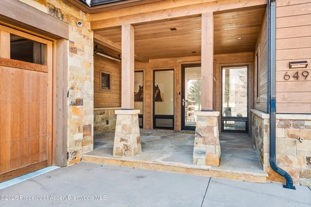 a view of a garden with mountains in the background