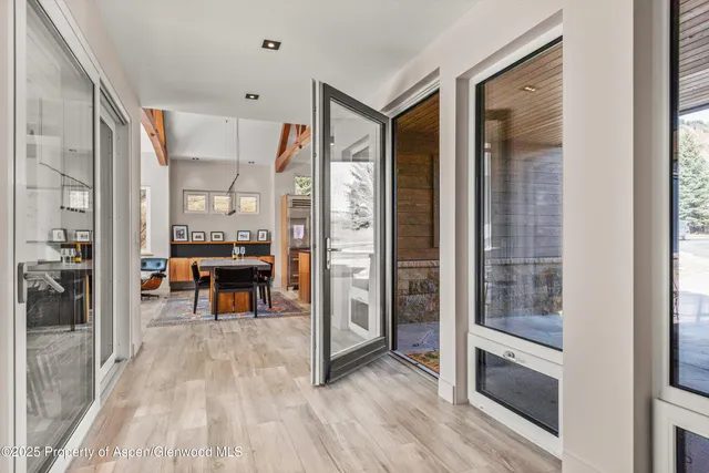 a aerial view of a house next to a yard