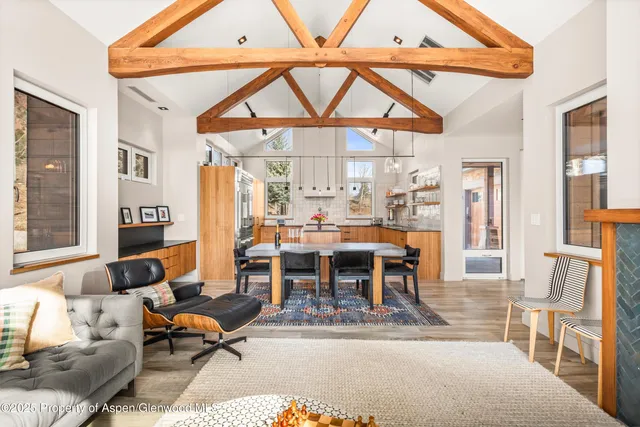 a kitchen with stainless steel appliances granite countertop a sink a stove and a refrigerator