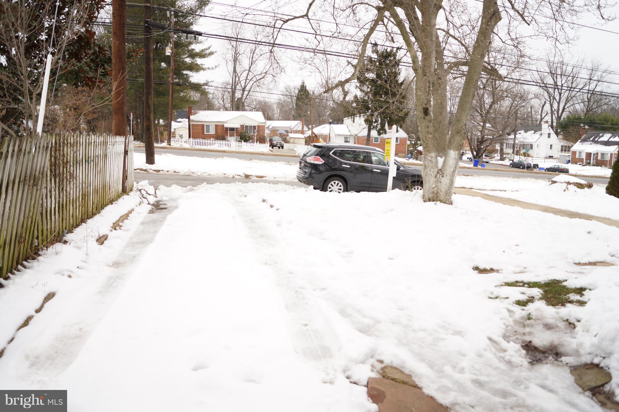 12116 Veirs Mill Road Silver Spring, MD 20906 - Photo 4 of 10 a view of road with residential house