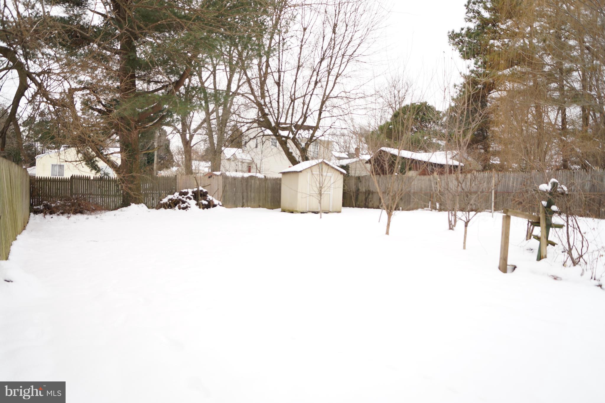 12116 Veirs Mill Road Silver Spring, MD 20906 - Photo 5 of 10 a street view covered with snow