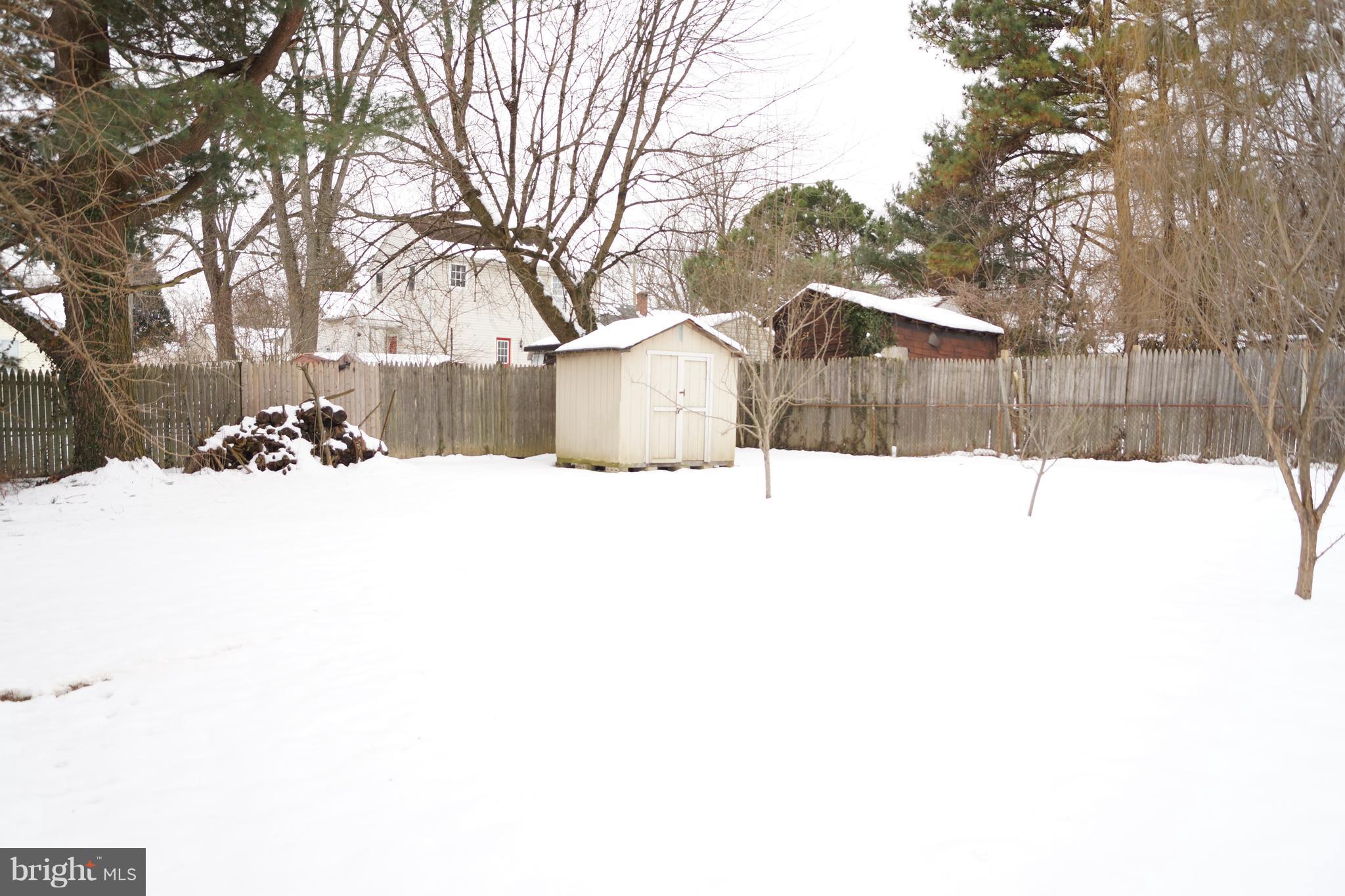 12116 Veirs Mill Road Silver Spring, MD 20906 - Photo 6 of 10 a view of a covered with snow in the backyard