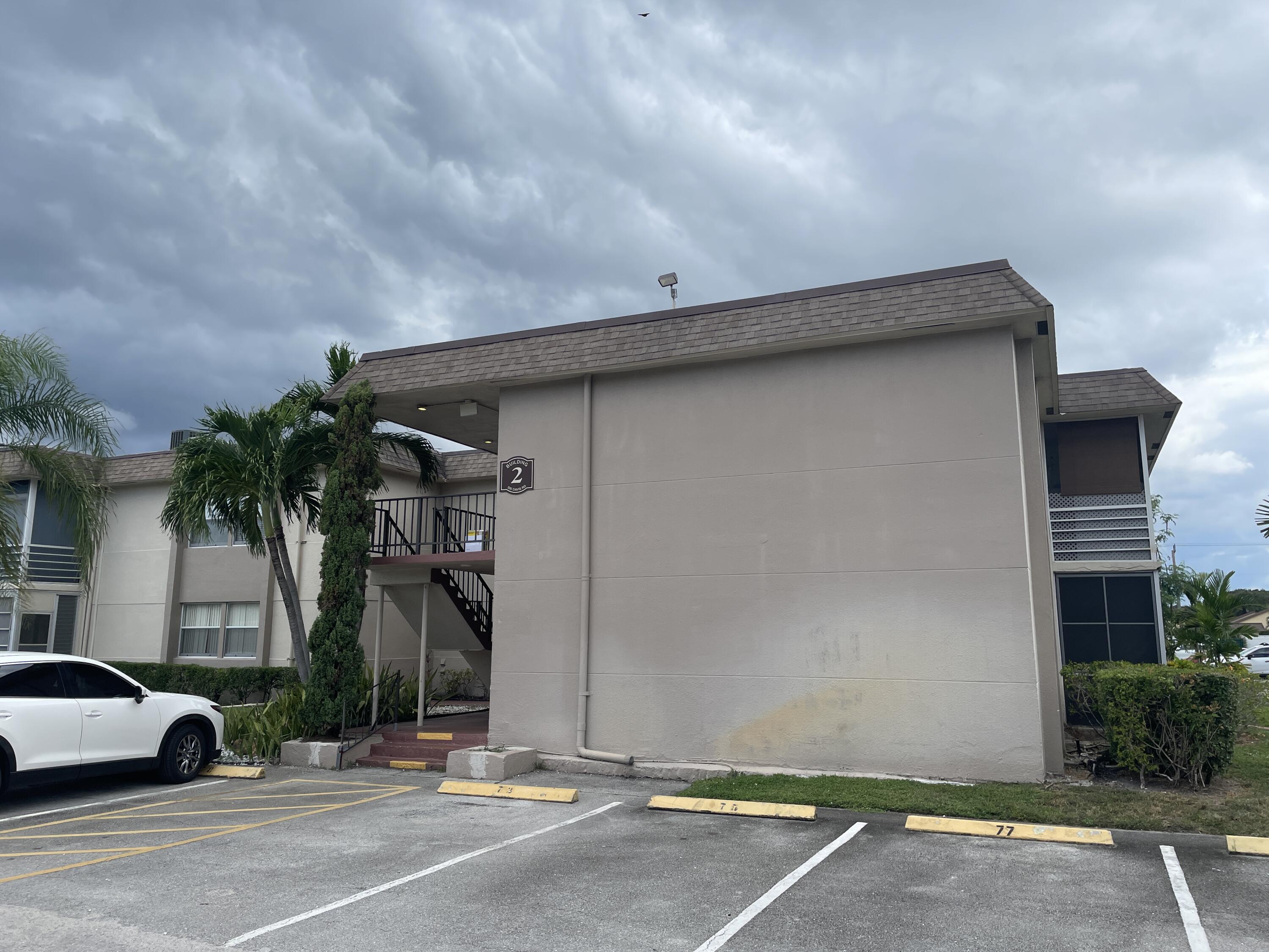 506 Davis Road, Unit 78 Palm Springs, FL 33461 - Photo 9 of 58 a couple of cars parked in front of a house