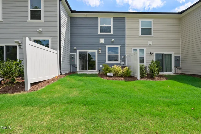 a view of a house with garden and plants