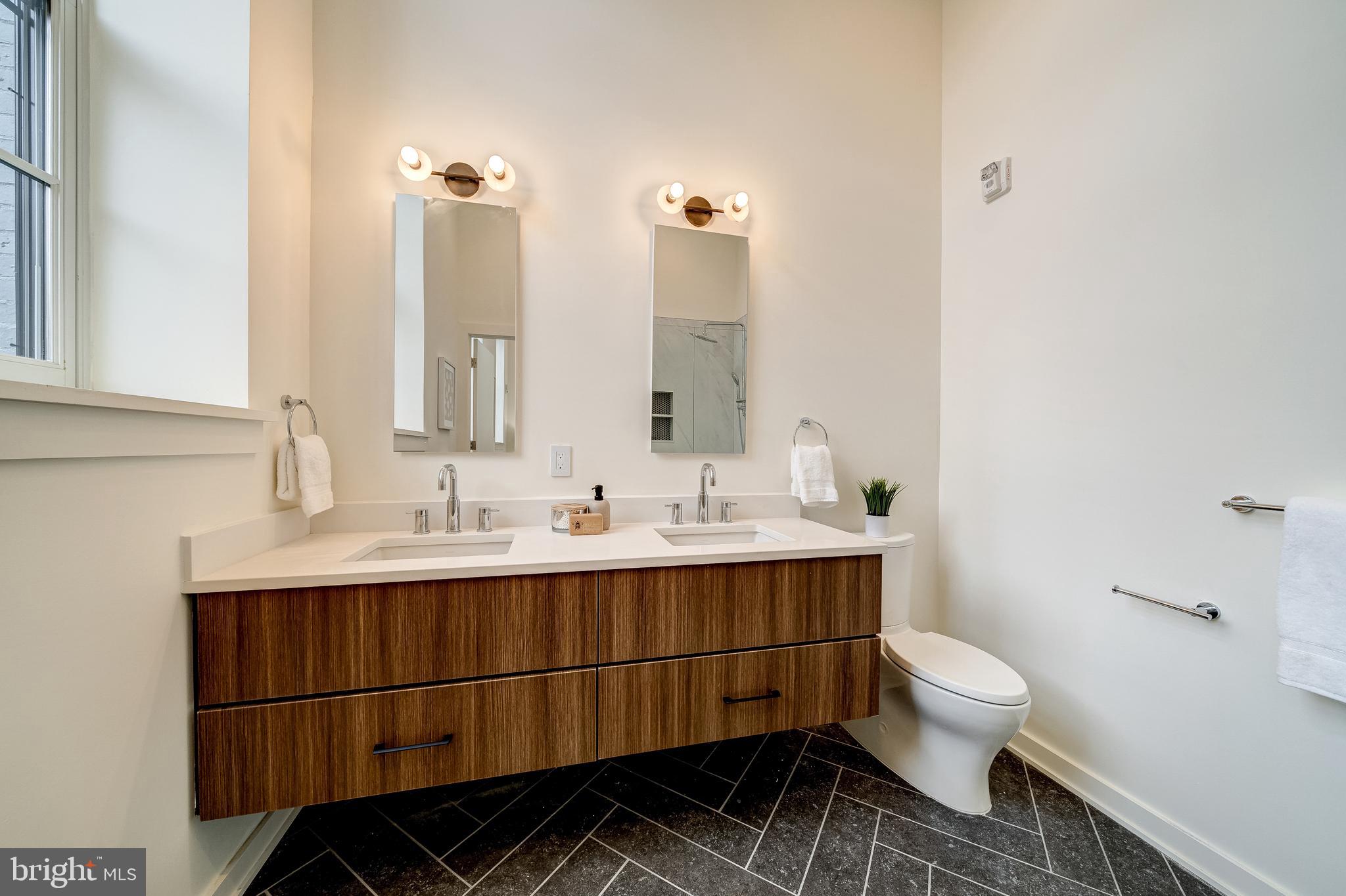 440 R Street Northwest, Unit 103 Washington, DC 20001 - Photo 12 of 22 Spa-like bathroom w/ dual vanity and luxe finishes