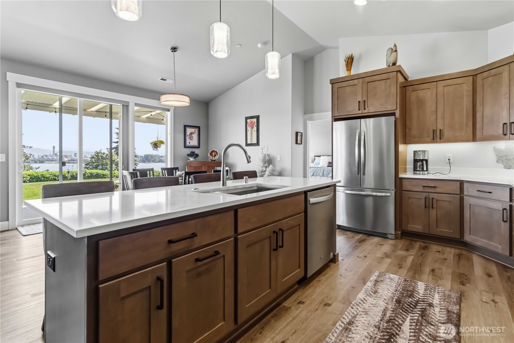 119 Old Mill Creek Road Longview, WA 98632 - Photo 10 of 40 a kitchen with refrigerator cabinets and wooden floor