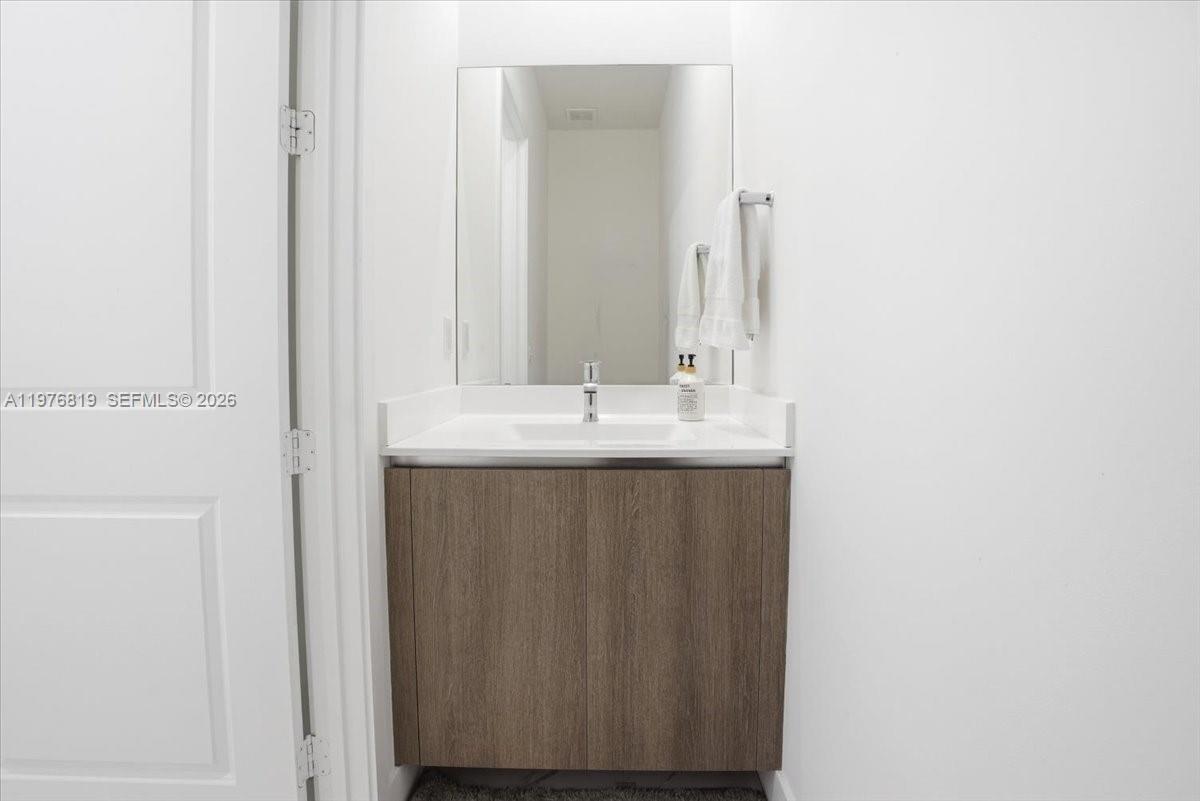 12060 Southwest 82nd Place Miami, FL 33156 - Photo 13 of 41 half bath downstairs