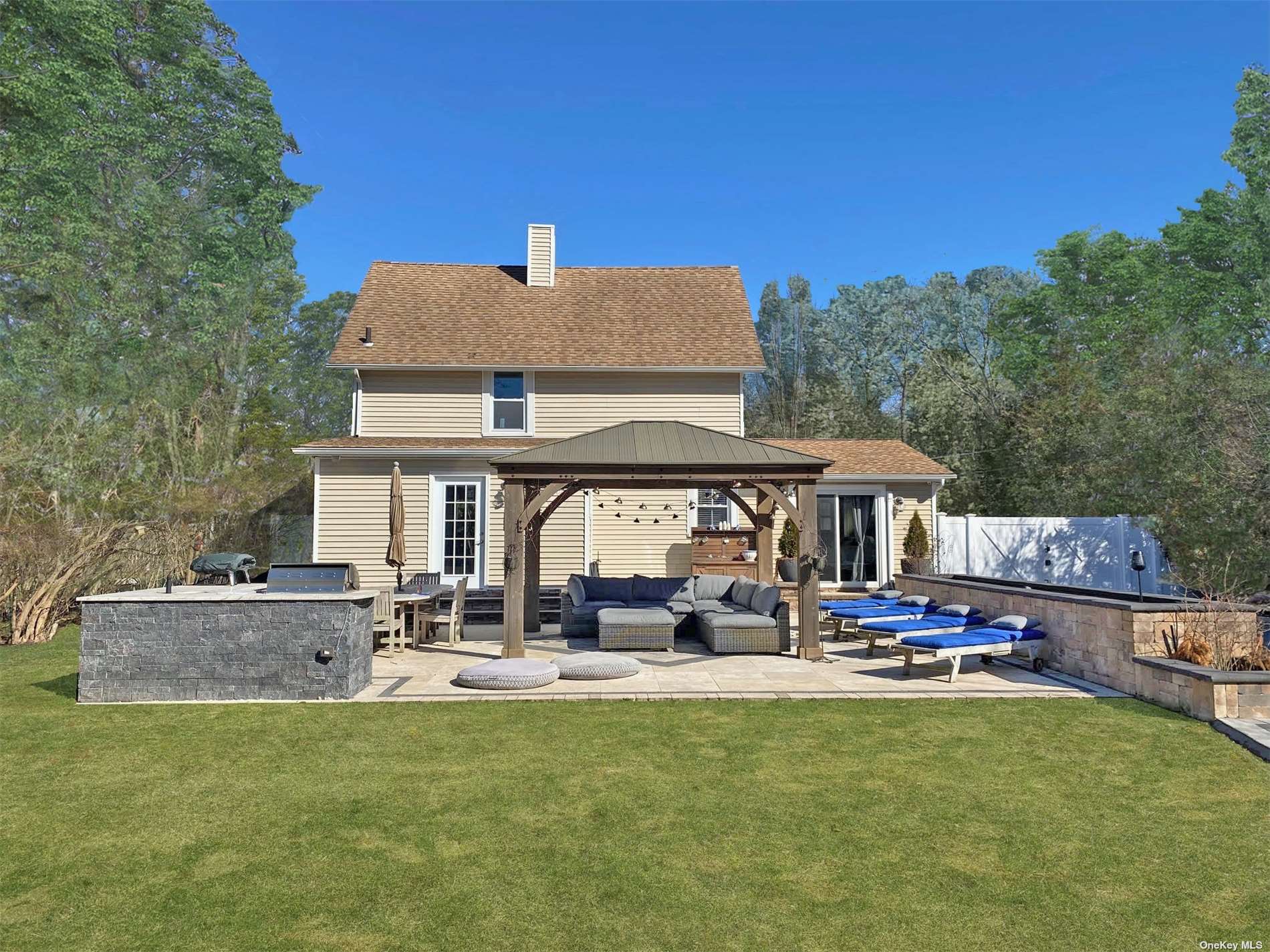 20 Atlantic Avenue East Moriches, NY 11940 - Photo 1 of 20 a view of a building with a patio