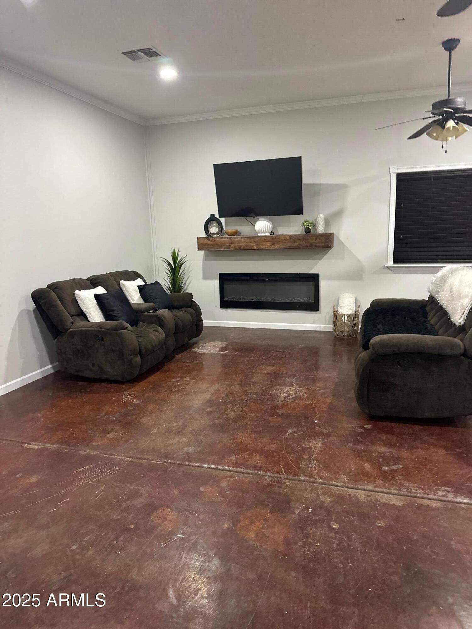 2266 East Willis Road, Unit CASITA Gilbert, AZ 85297 - Photo 1 of 12 a living room with furniture and a flat screen tv