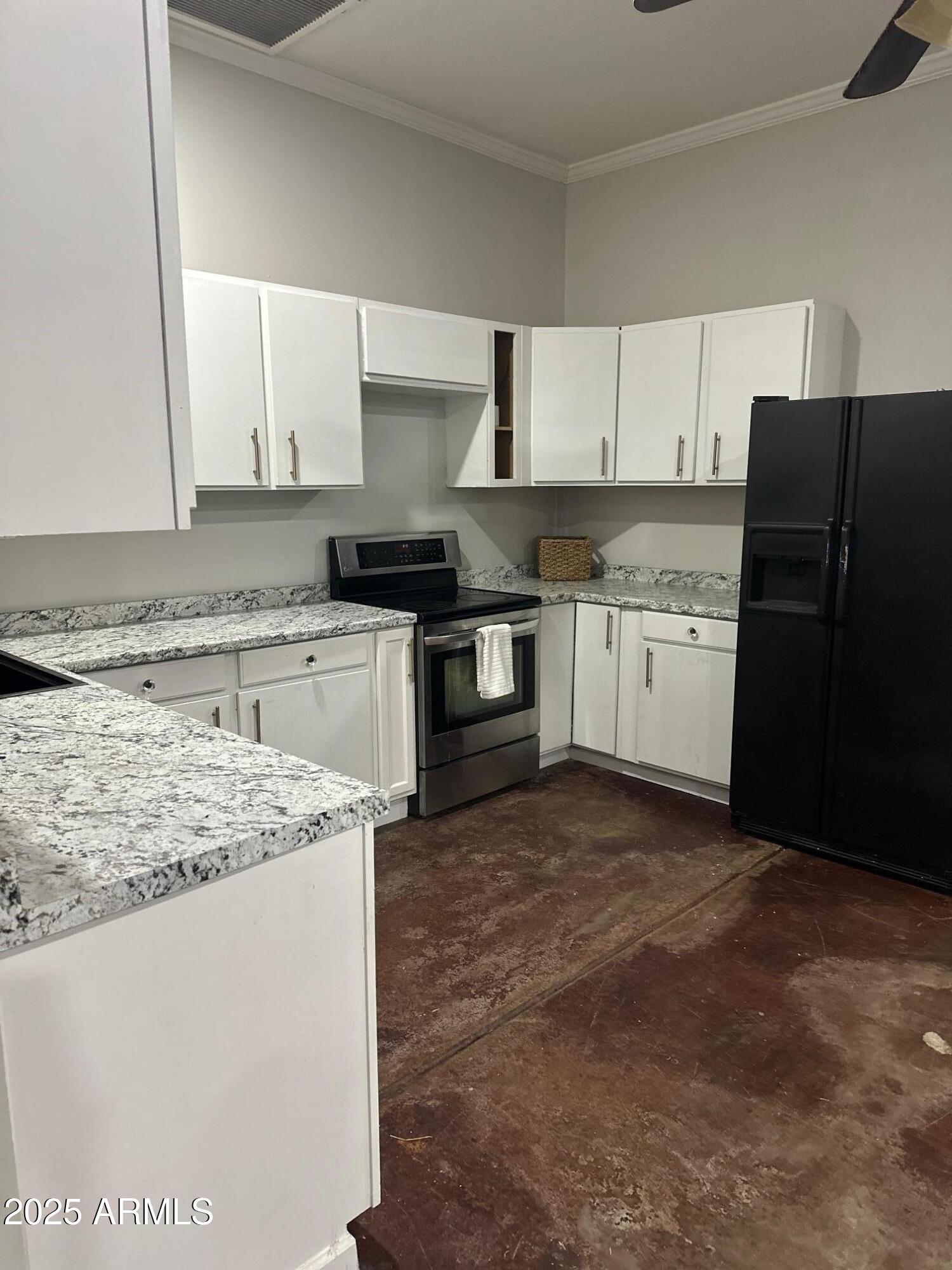2266 East Willis Road, Unit CASITA Gilbert, AZ 85297 - Photo 3 of 12 a kitchen with stainless steel appliances granite countertop a stove a sink and a refrigerator