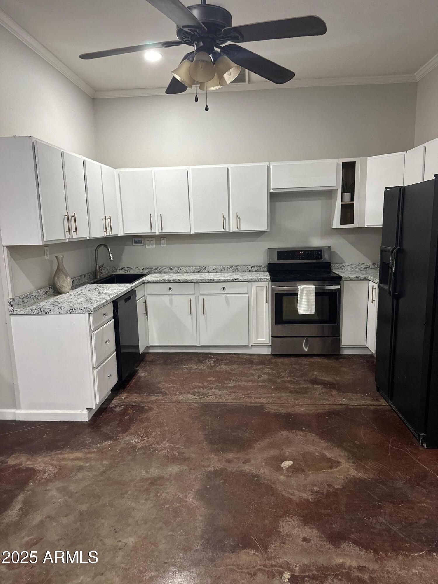2266 East Willis Road, Unit CASITA Gilbert, AZ 85297 - Photo 9 of 12 a kitchen with stainless steel appliances granite countertop a stove a refrigerator a sink a stove with white cabinets