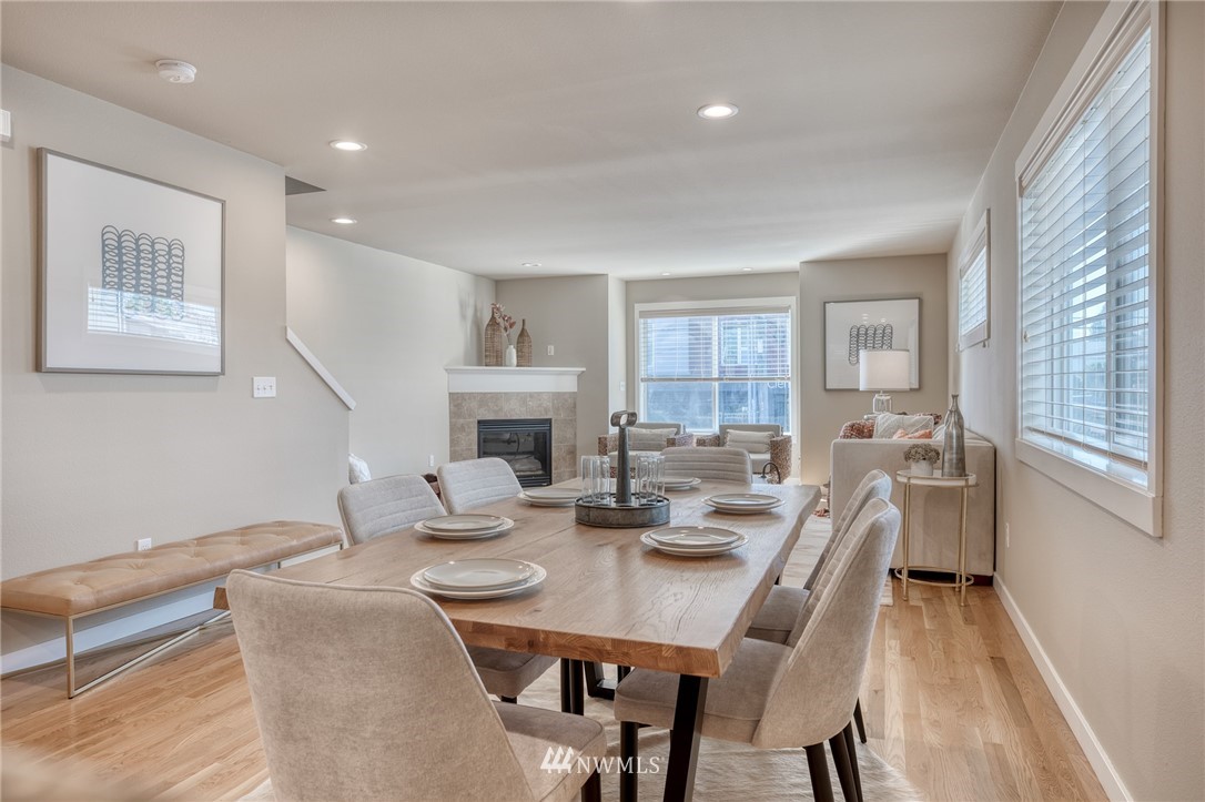 946 North 96th Street Seattle, WA 98103 - Photo 14 of 24 a view of a dining room with furniture window and wooden floor