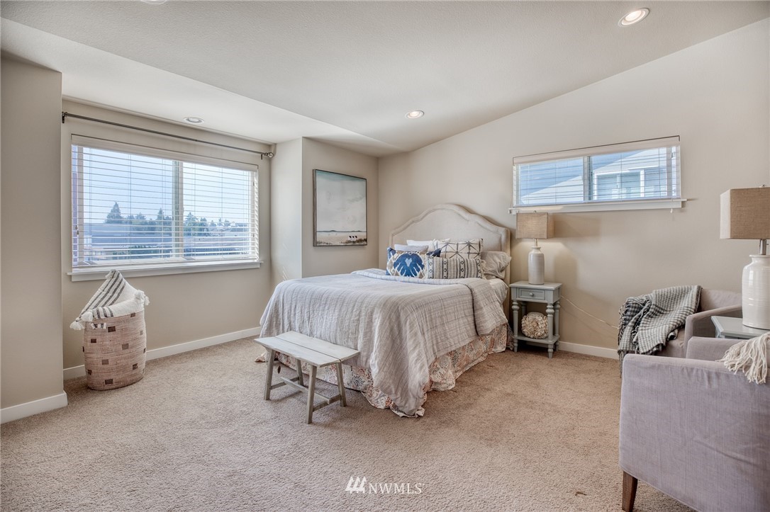 946 North 96th Street Seattle, WA 98103 - Photo 19 of 24 a bedroom with a bed and a window