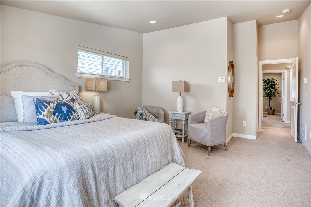 946 North 96th Street Seattle, WA 98103 - Photo 20 of 24 a spacious bedroom with two beds and a window