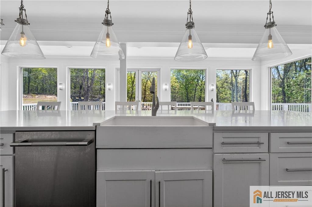 381 Monmouth Road Freehold, NJ 07728 - Photo 19 of 63 a kitchen with a sink and large windows
