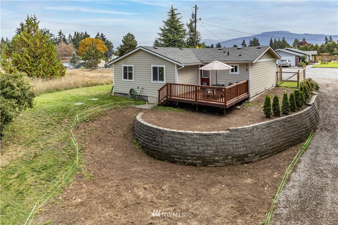124 Fitzgerald Road Sequim, WA 98382 - Photo 23 of 25 a view of a house with backyard and sitting area