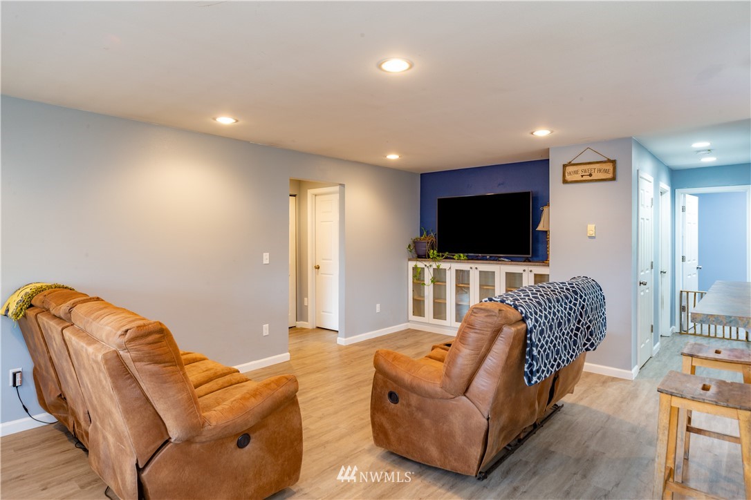 124 Fitzgerald Road Sequim, WA 98382 - Photo 9 of 25 a living room with furniture and a flat screen tv