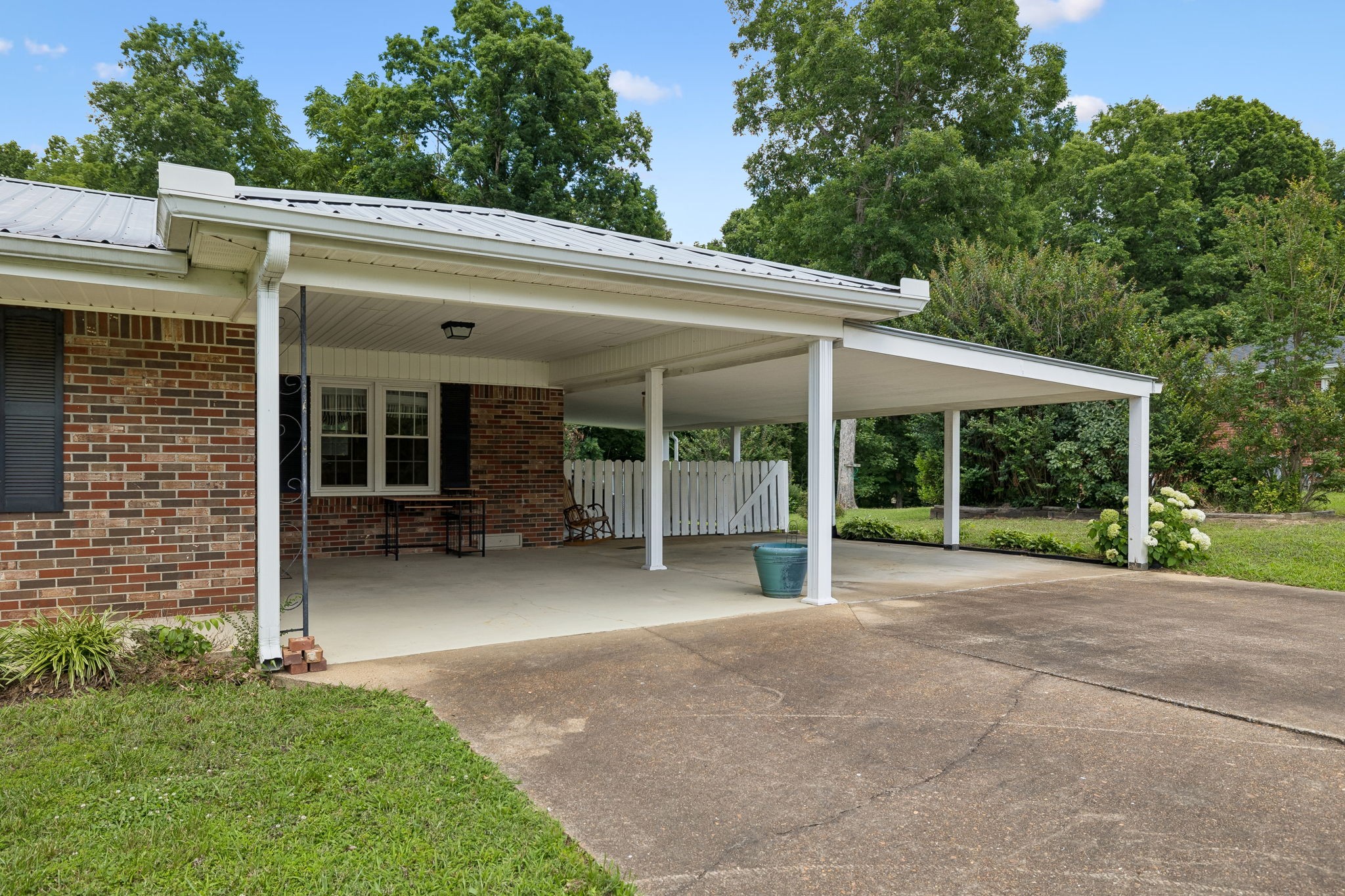 708 Hickory Street Centerville, TN 37033 - Photo 5 of 57 a view of a house with backyard and porch