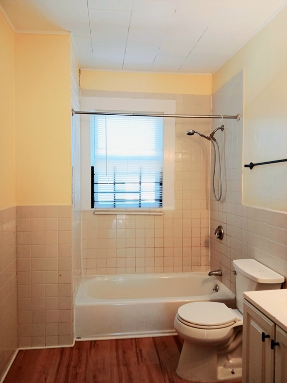 44 B Park Street, Unit 3 Lynn, MA 01905 - Photo 8 of 9 a bathroom with a sink a toilet and shower