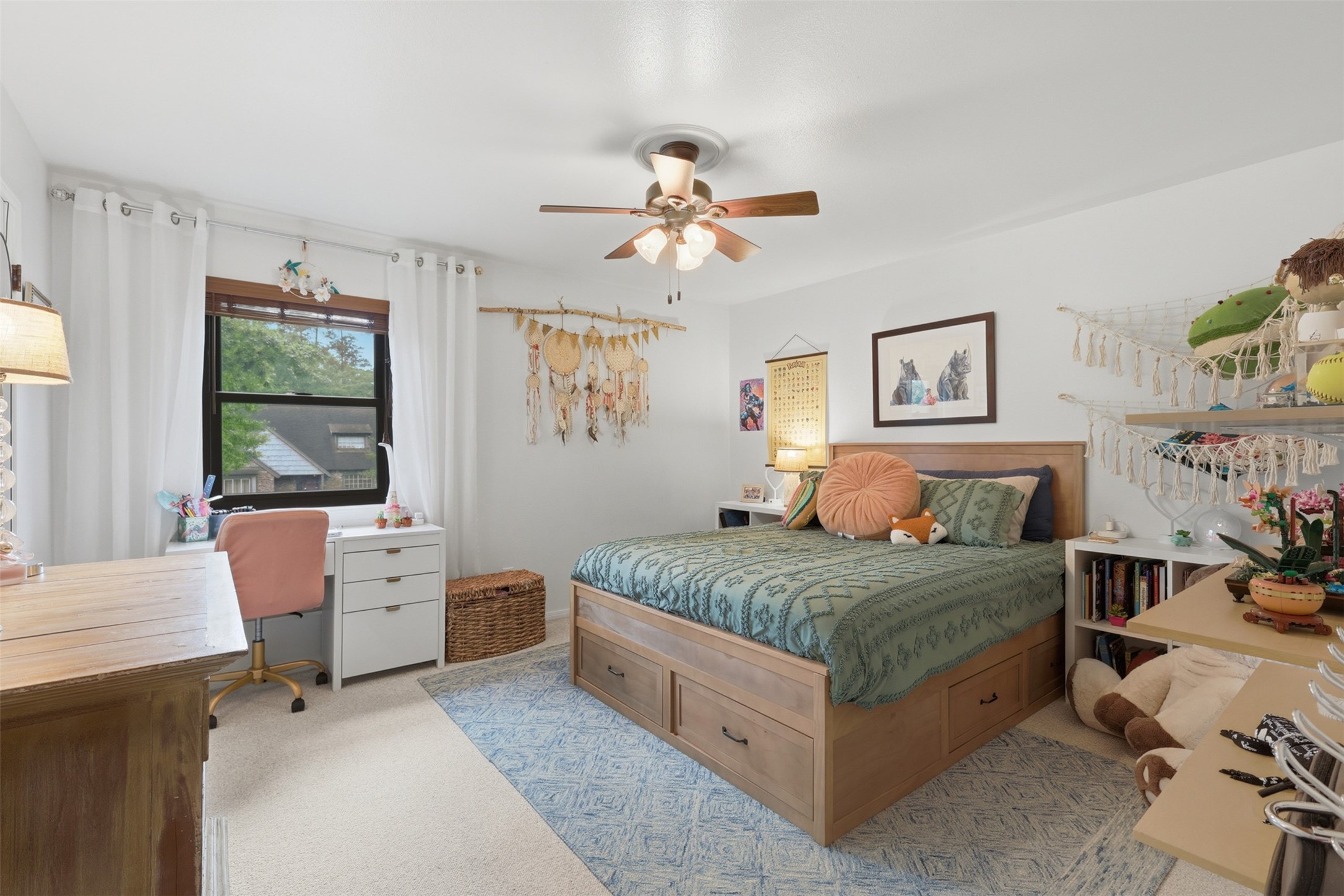 6126 Hickorycrest Drive Spring, TX 77389 - Photo 22 of 50 Secondary bedroom with ample natural light and a ceiling fan for comfort.