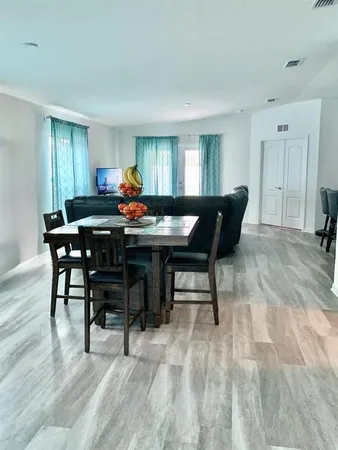 a view of a dining room with furniture